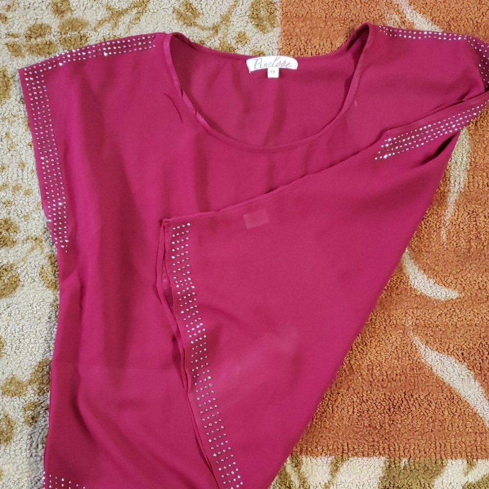 Burgandy shirts with beaded detail.